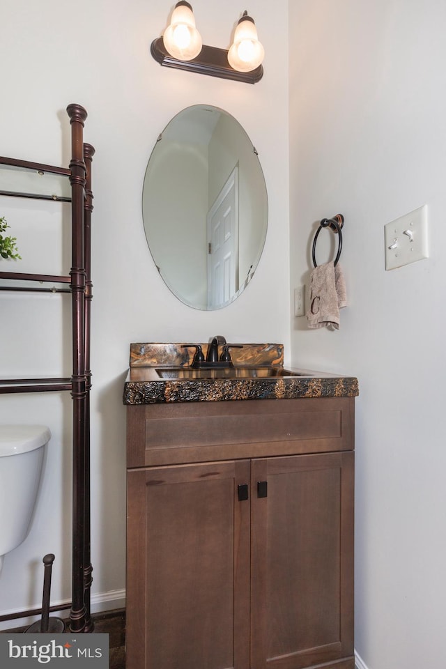 3560 Sherwin Dr, Manchester, MD 21102 - half bath featuring baseboards, vanity, and toilet