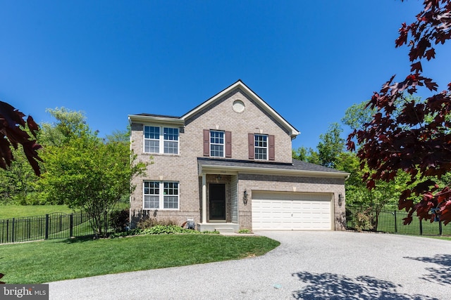 3560 Sherwin Dr, Manchester, MD 21102 - traditional-style home with asphalt driveway, brick siding, and an attached garage
