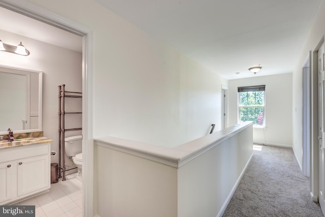 3560 Sherwin Dr, Manchester, MD 21102 - corridor featuring an upstairs landing, a sink, light colored carpet, and baseboards