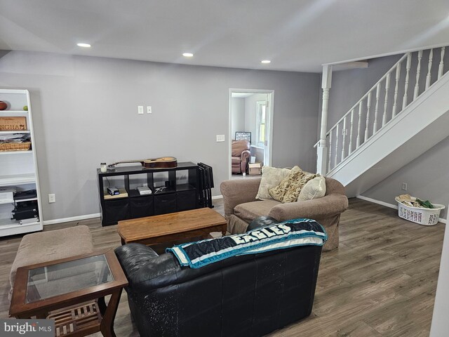 56 Coral Ln, Levittown, PA 19055 - living area featuring wood finished floors, baseboards, recessed lighting, and stairs