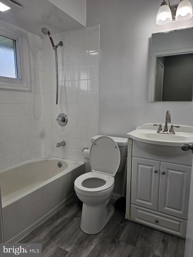 56 Coral Ln, Levittown, PA 19055 - full bath with toilet, vanity, shower / washtub combination, and wood finished floors