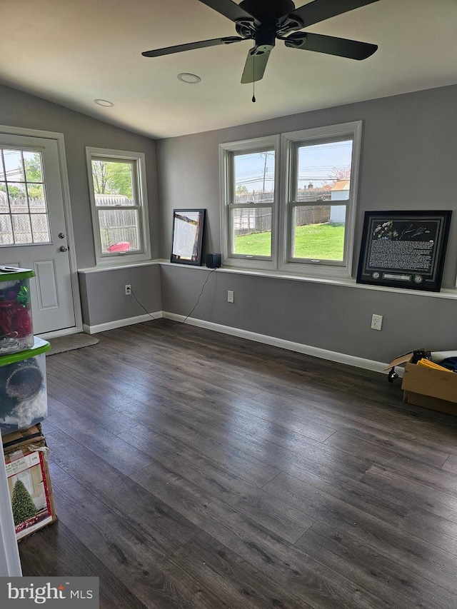 56 Coral Ln, Levittown, PA 19055 - unfurnished living room with baseboards, a ceiling fan, and dark wood-style flooring