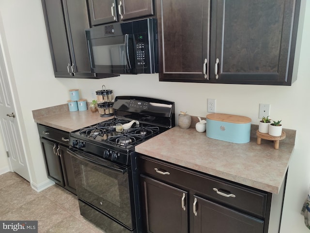 117 E Clarendon Dr, Smyrna, DE 19977 - kitchen with black appliances, light tile patterned flooring, dark brown cabinets, and light countertops