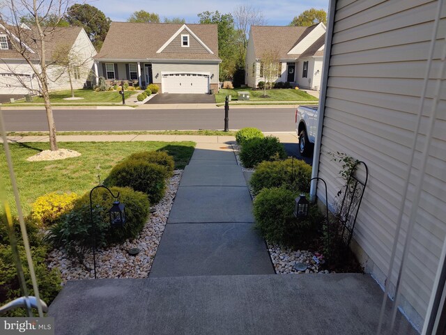 117 E Clarendon Dr, Smyrna, DE 19977 - view of yard featuring driveway and an attached garage