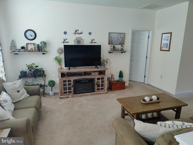 117 E Clarendon Dr, Smyrna, DE 19977 - carpeted living area with visible vents and baseboards