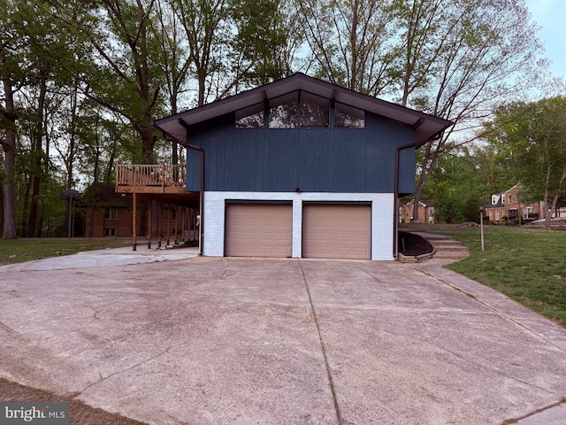 garage featuring concrete driveway