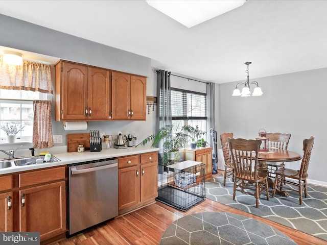 29 Blueberry Ln, Keyser, WV 26726 - kitchen featuring a sink, brown cabinets, light wood finished floors, a wealth of natural light, and stainless steel dishwasher