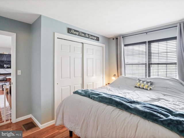 29 Blueberry Ln, Keyser, WV 26726 - bedroom featuring a closet, baseboards, visible vents, and wood finished floors