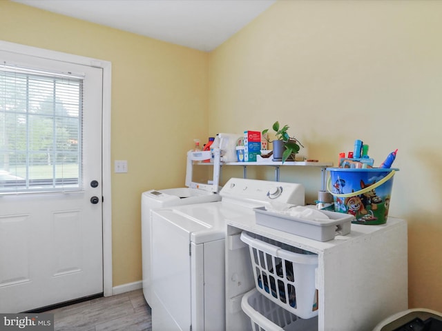 29 Blueberry Ln, Keyser, WV 26726 - clothes washing area featuring laundry area, baseboards, separate washer and dryer, and wood finished floors