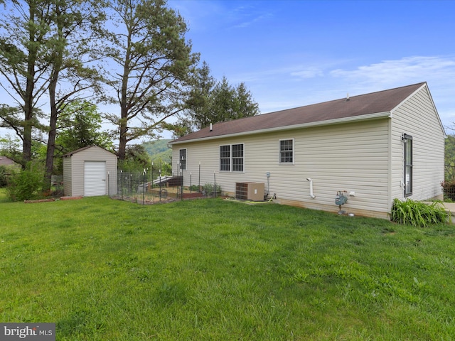 29 Blueberry Ln, Keyser, WV 26726 - rear view of property featuring a storage shed, cooling unit, fence, an outdoor structure, and a yard