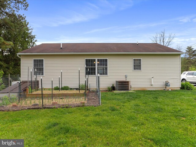 29 Blueberry Ln, Keyser, WV 26726 - back of house with a lawn, central AC, and fence