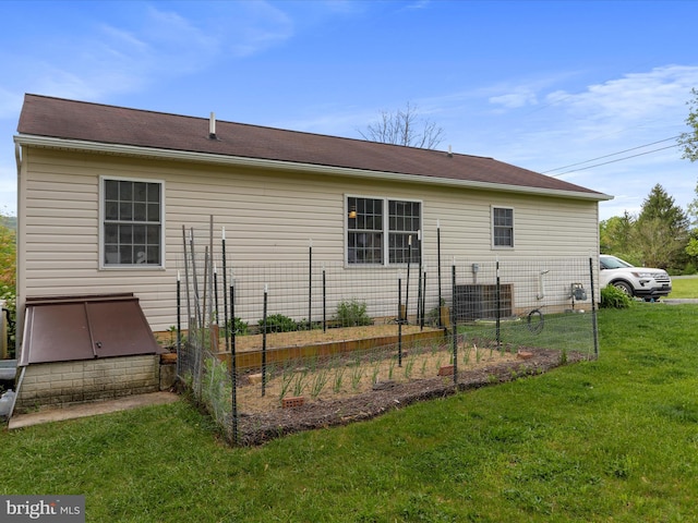 29 Blueberry Ln, Keyser, WV 26726 - rear view of property featuring a yard, fence, a garden, and central AC