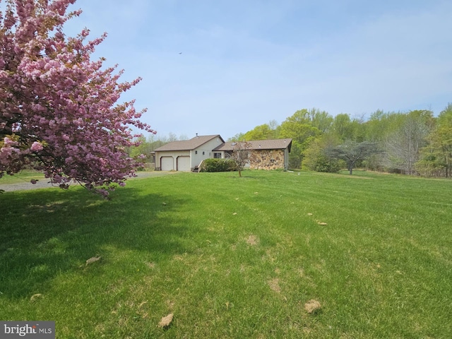 view of yard featuring an attached garage