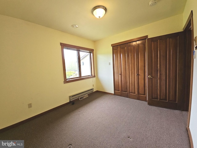 unfurnished bedroom featuring dark colored carpet, visible vents, and baseboards