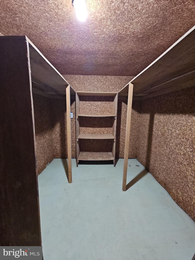 unfurnished bedroom with finished concrete floors