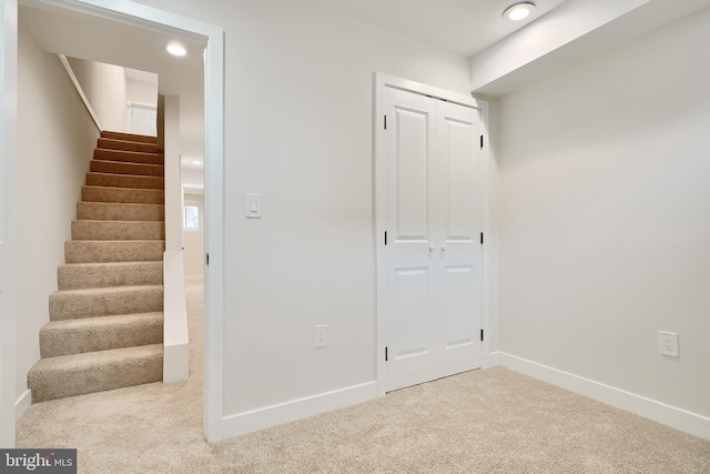 staircase featuring recessed lighting, carpet flooring, and baseboards