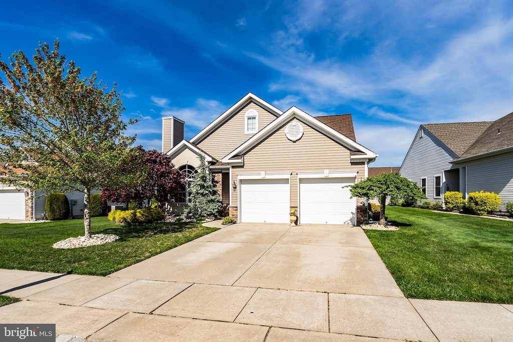 50 Avalon Way, Waretown, NJ 08758 - view of front of house with a garage, concrete driveway, and a front yard