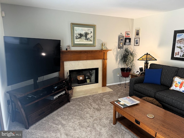 living area featuring a fireplace and carpet flooring