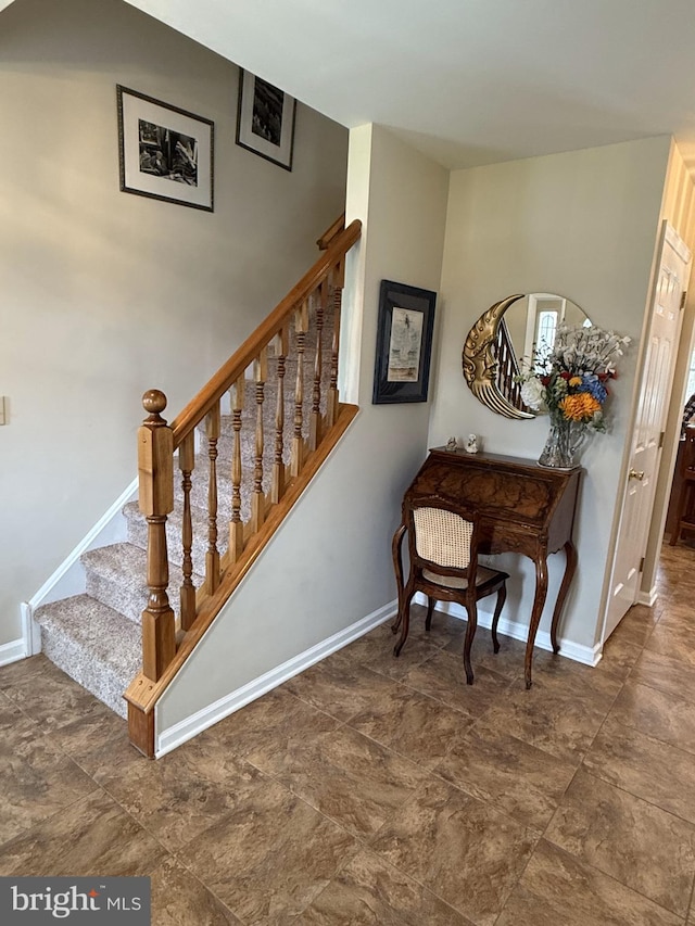 stairway with baseboards