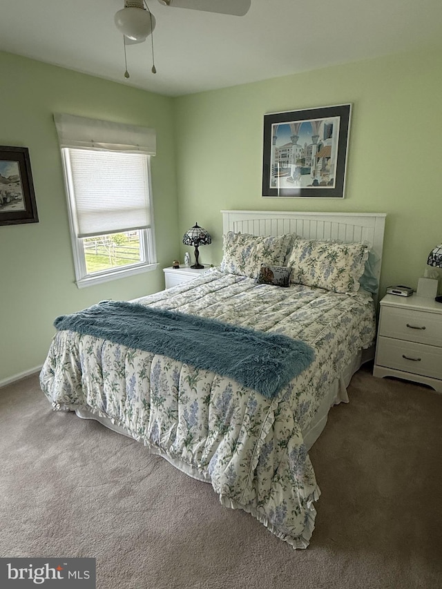 carpeted bedroom with ceiling fan