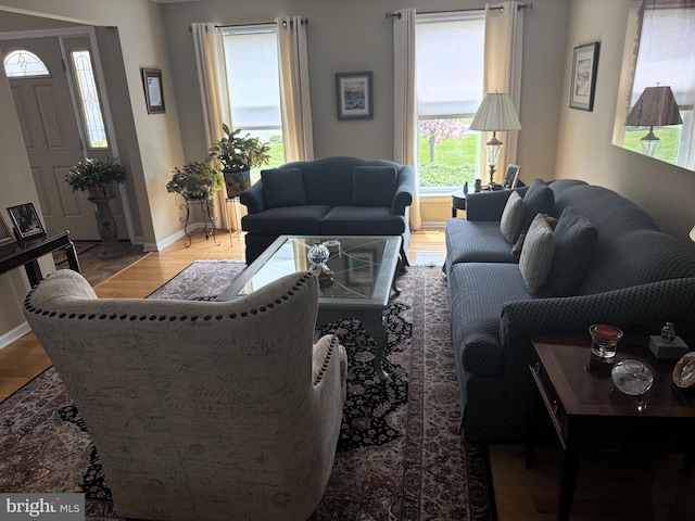living room with wood finished floors and baseboards