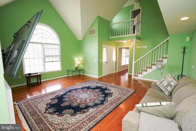 30085 Haymarket Ct, Salisbury, MD 21804 - living area featuring stairs, wood finished floors, high vaulted ceiling, baseboards, and recessed lighting