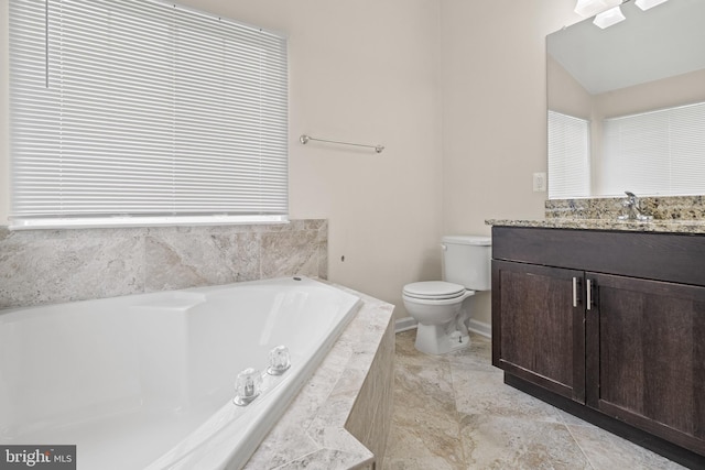full bathroom with toilet, a bath, vanity, and baseboards