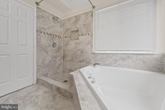 bathroom featuring a tile shower and a bath