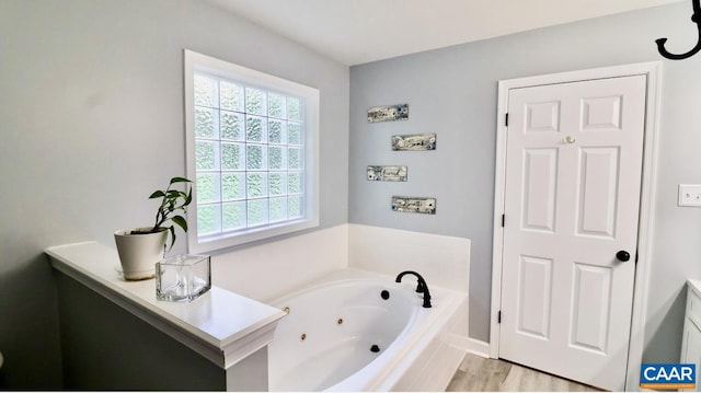 full bathroom with a jetted tub