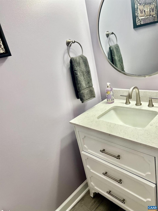 bathroom featuring vanity and baseboards