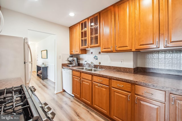 351 Gatewater Ct Unit C, Glen Burnie, MD 21060 - kitchen with a sink, white appliances, light wood finished floors, dark countertops, and brown cabinetry