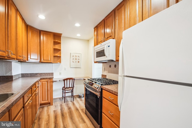 351 Gatewater Ct Unit C, Glen Burnie, MD 21060 - kitchen with white appliances, light wood-type flooring, brown cabinets, dark countertops, and recessed lighting
