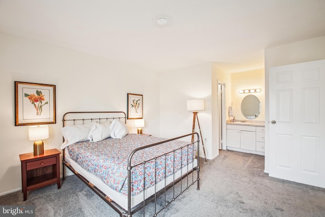 351 Gatewater Ct Unit C, Glen Burnie, MD 21060 - carpeted bedroom featuring ensuite bathroom, a sink, and baseboards