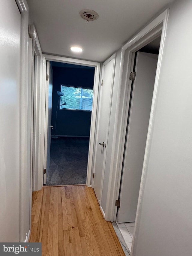 hallway featuring light wood finished floors