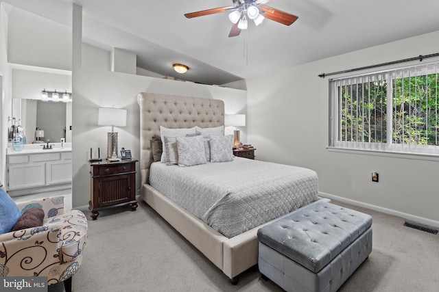 8101 Greenspring Way Unit 8101-E, Owings Mills, MD 21117 - bedroom with ensuite bath, light colored carpet, a sink, baseboards, and visible vents