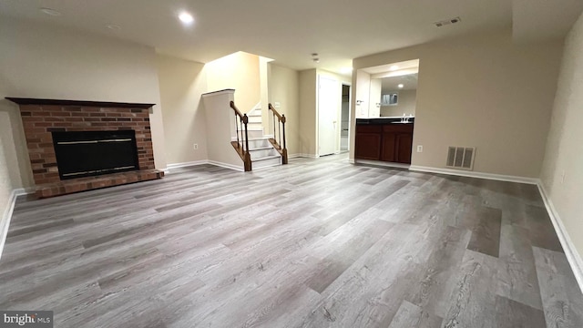 20002 Apperson Pl, Germantown, MD 20876 - unfurnished living room with baseboards, visible vents, wood finished floors, and stairway