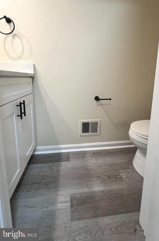 20002 Apperson Pl, Germantown, MD 20876 - bathroom with baseboards, visible vents, wood finished floors, and vanity