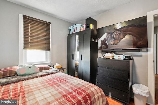 bedroom with wood finished floors