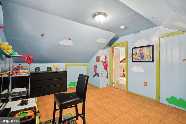 playroom with baseboards and lofted ceiling