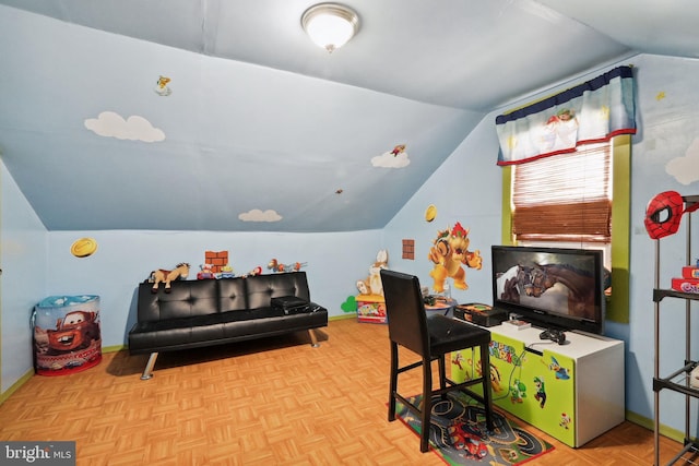 rec room with baseboards and lofted ceiling
