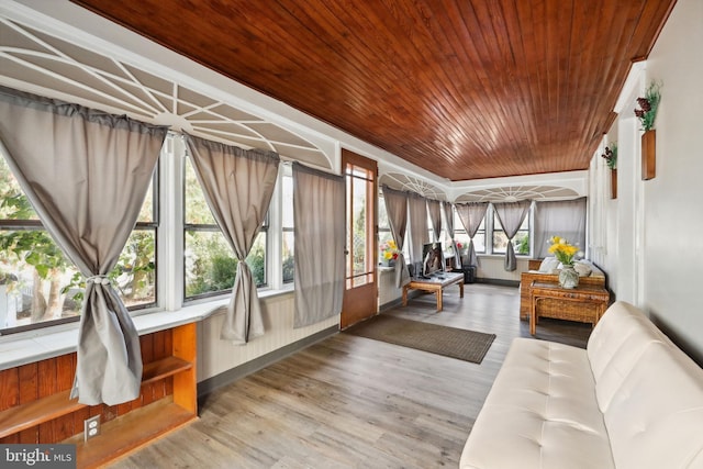 sunroom with wooden ceiling and wood finished floors