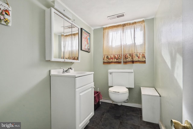 half bathroom featuring tile patterned flooring, vanity, toilet, baseboards, and visible vents