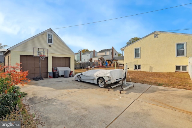 view of home's exterior featuring an outbuilding and a detached garage