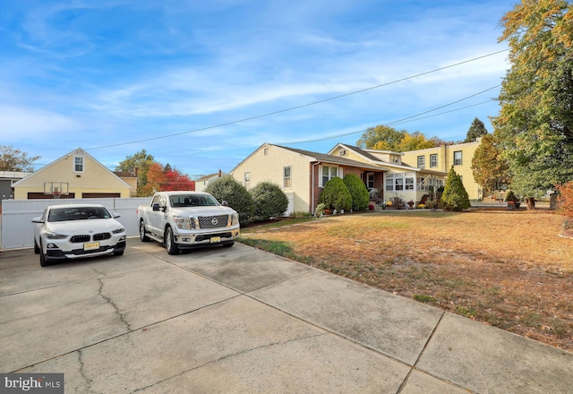 view of front of property with fence and a front yard