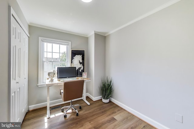 office with baseboards, crown molding, and wood finished floors