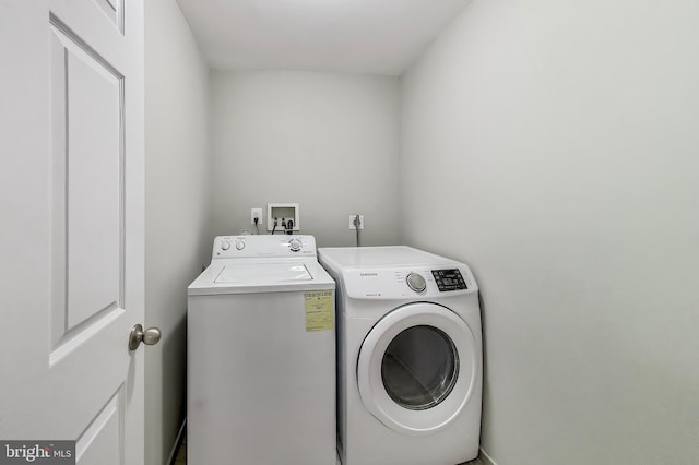 laundry room featuring laundry area and washing machine and clothes dryer
