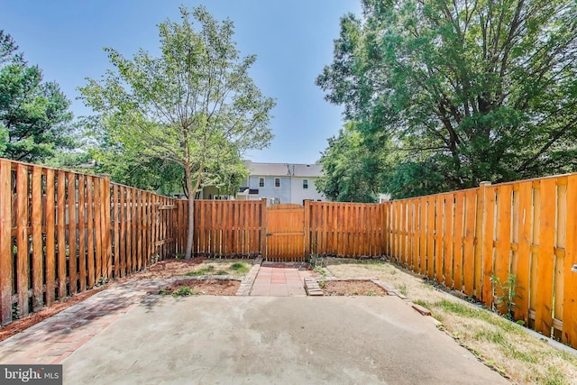 view of patio / terrace with a fenced backyard and a gate