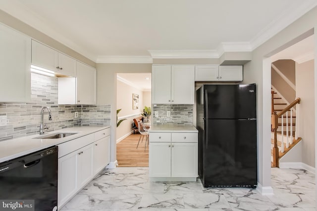 kitchen featuring crown molding, a sink, marble finish floor, and black appliances