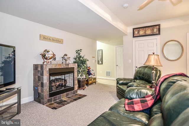 107 Washington Square Ct, Occoquan, VA 22125 - carpeted living room with visible vents, ceiling fan, tile patterned floors, and a fireplace