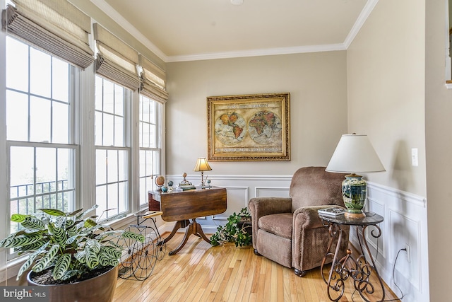 107 Washington Square Ct, Occoquan, VA 22125 - sitting room with crown molding, a decorative wall, a wainscoted wall, and hardwood / wood-style floors